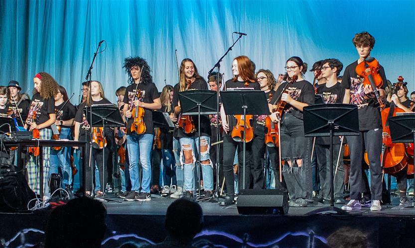 Orchestra students perform onstage